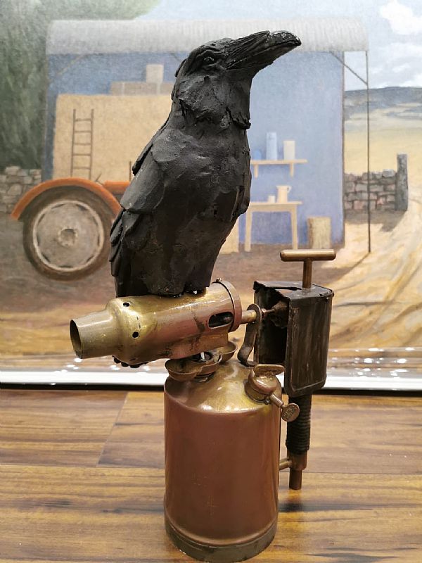 View  raven with blow torch