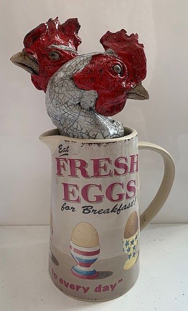 View Chicken in fresh eggs jug